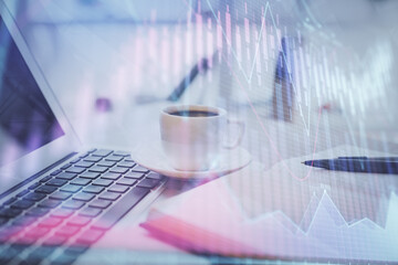 Double exposure of financial chart drawing and desktop with coffee and items on table background....