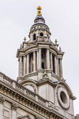 Fototapeta na wymiar Architectural fragments of Magnificent St. Paul Cathedral (1675 - 1711) in London. St. Paul Cathedral sits at top of Ludgate Hill - highest point in City of London. UK.