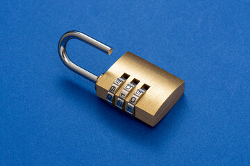 Unlocked golden padlock on the blue background.