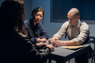 The investigator conducts an interrogation, shows the suspect photos of accomplices.