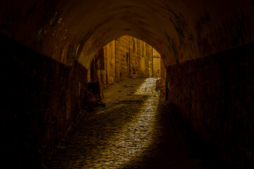 tunnel in the old town, stone tunnel, light coming into tunnel, stone ways, stone city, old city mardin, abbara tunnels