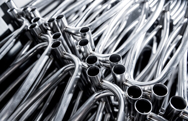 Abstract industrial background of metal pipes construction.