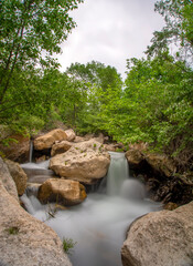 Motion Blur Waterfalls Peaceful Nature Landscape In  Mountains With Lush Green Trees,