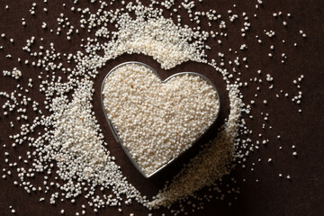 Uncooked Fonio Grain in a Heart Shape