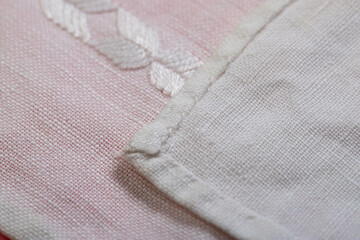 Fototapeta na wymiar hand embroidery on linen and cotton fabric, homespun cloth, Richelieu and mesh, background