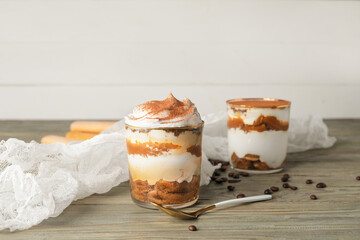 Sweet tasty tiramisu on table