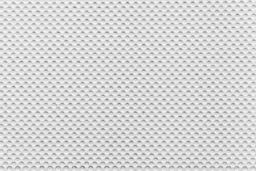 White plastic sheet with polka dots pattern and seamless background