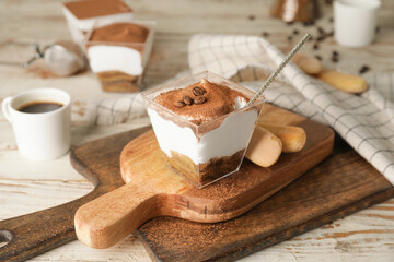 Sweet tasty tiramisu on table