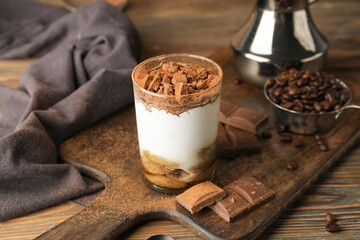 Sweet tasty tiramisu on table