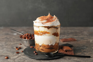 Sweet tasty tiramisu on table