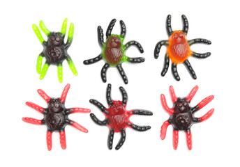 Tasty scary candies for Halloween on white background