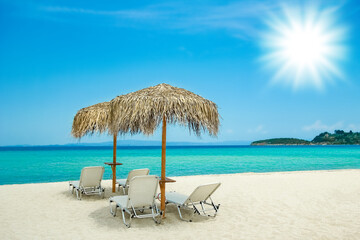 beautiful beach chairs near the seashore of Greece on the nature background