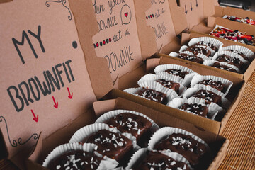 Shot of brownies in boxes with an inscription 