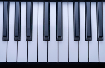 CLOSE UP OF PIANO KEYS. MUSIC CONCEPT. TOP VIEW.