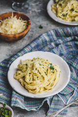 Portions of Fettuccine with Alfredo Sauce