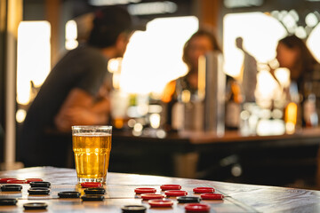 Traveling droughts game with a glass of beer on a bar