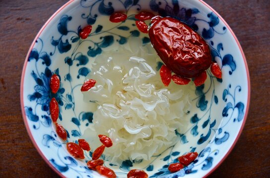 Tremella fuciformis (White Snow Fungus), goji berries and red dates nutritiously rich to cook together as healthy sweet soup dessert, or as supplement.  Top view