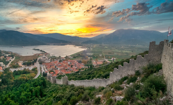 Dreamy sunset sky above Maly Ston castle and salt mines on the Adriatic Coast of Croatia