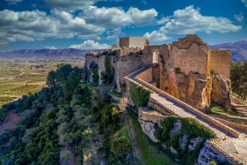 Fototapeta na wymiar Aerial view of Montesa castle near Valencia Spain former stronghold of the crusader knights with ramp leading up to the gate and a ruined knights hall