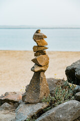 Stacked pebbles on the beach at sunset, Morro Bay State Park, California