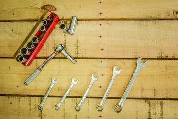 Hand tools, Sockets and wrenches on work bench.