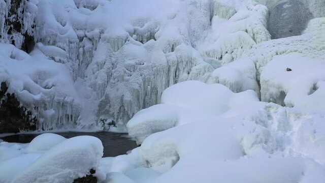 Video of ice icicles over frozen river Pescherka