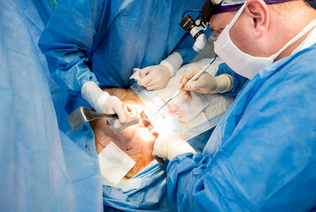 Surgery to remove the breast and replace it with an implant.