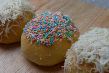 Cake with colorful sprinkles and grated cheese