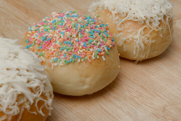 Cake with colorful sprinkles and grated cheese