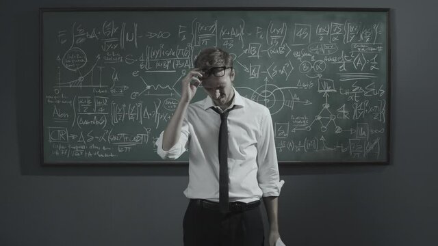 Disappointed mathematician checking his research papers