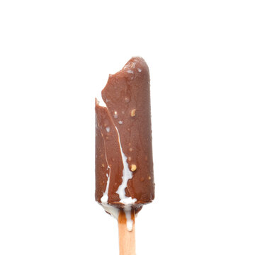 A picture of bitten coco bar ice cream with vanilla flavour flowing out on isolated white background.