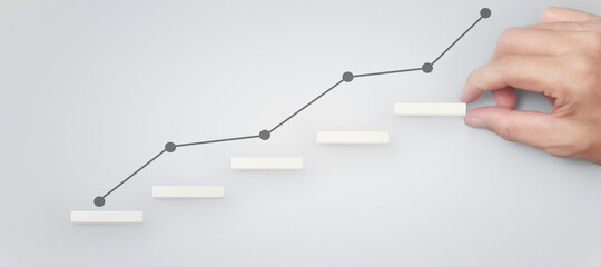 Block stacking as step stair in hand. Business concept for growth
