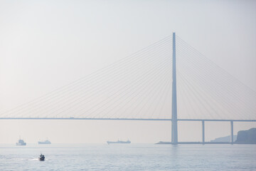 Russian bridge in Vladivostok is shrouded in thick fog