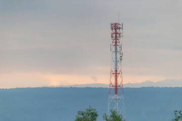 Telephone network towers on Khao Yai national park background mountain in silhouette. radar towers