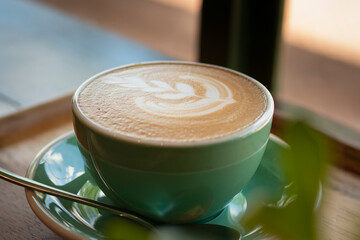Soft focus on A Cup of Coffee. Close up on the top of Hot Latte Art.