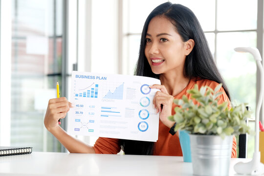 Asian woman presenting business plan information at home office, Asia female explaning business growth chart to analysis for project strategy