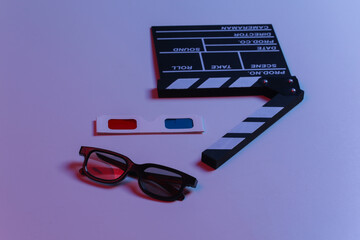 Film clapper board with 3d glasses in blue red neon light. Cinema industry, entertainment.