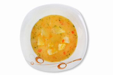 Homemade vegetable soup from fresh and useful products which submit on the first dish. Isolated on a white background. Top view.