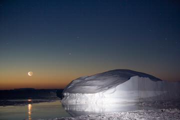 Icebergs and Setting Moon, Antarctica © Paul