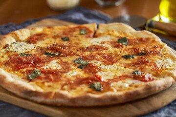 neapolitan style margherita pizza on wooden peel