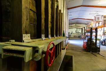 Obraz na płótnie Canvas Image of hall with a automatization press for apples in factory, Asturian Sidreria
