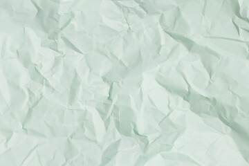 green crumpled paper background, texture for web design screensavers.