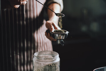 Close-up of preparing green tea from professional Barista self through green tea powder