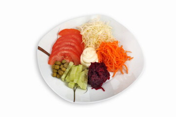 Assorted salad from vegetables on the plate