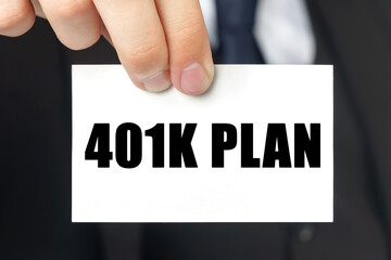 Businessman shows a card with the text - 401K PLAN