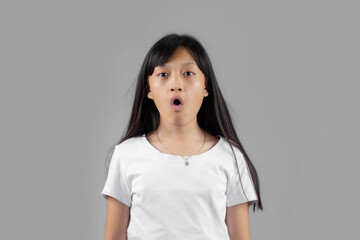 Asian girl studio portrait on gray background