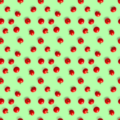 Seamless pattern with red ripe tomatoes. Tomato isolated on green background. Vegetable abstract seamless pattern. Organic Tomatoes flat lay