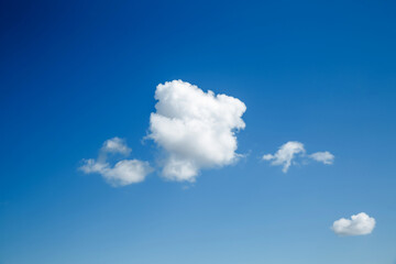 Naklejka na ściany i meble White, Fluffy Clouds In Blue Sky. Background From Clouds