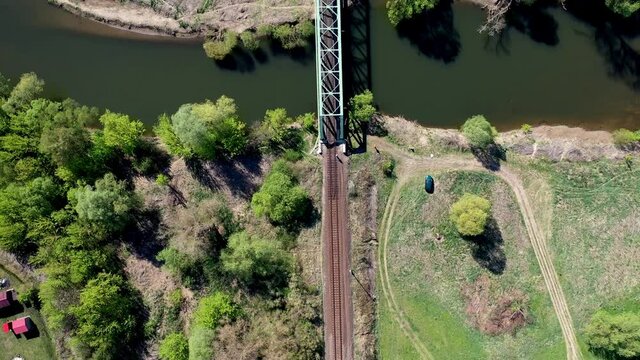 Drone fly over train track. Bridge crossing a river. 