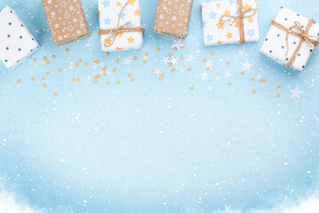 Christmas gift boxes over blue background